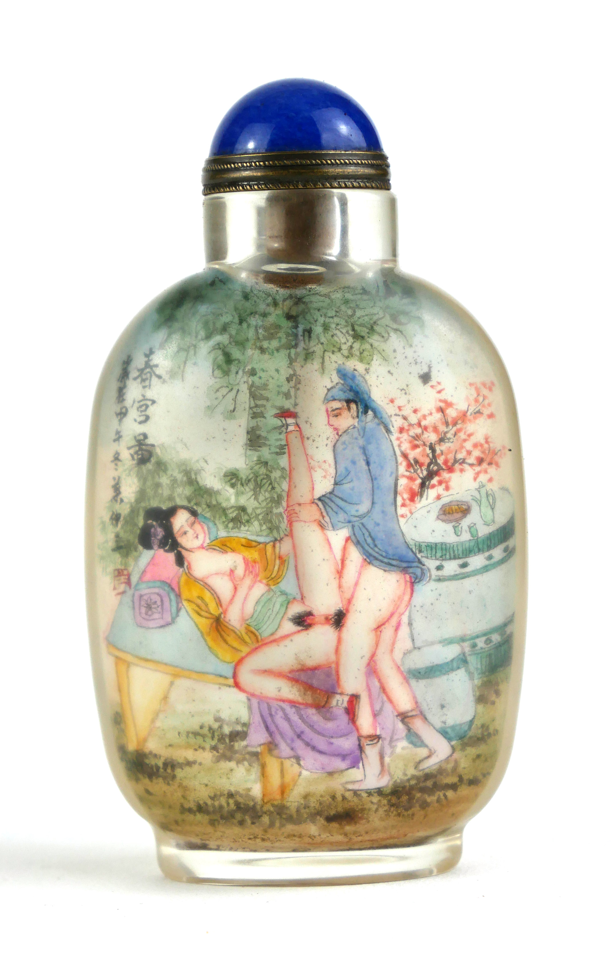 A CHINESE EROTIC REVERSE PAINTED FROSTED GLASS AND LAPIS LAZULI SNUFF BOTTLE Having a cabochon cut