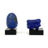 TWO CARVED LAPIS LAZULI MINIATURE SCULPTURES Chinese seated Buddha within a shrine and an Egyptian