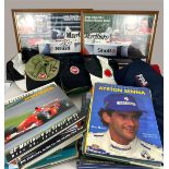 AN ASSORTMENT OF FOMULA 1 RACING MEMORABILIA To include two signed pictures, Alain Prost, Ayrton