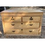 A GEORGIAN PINE CHEST Two short above two long drawers with reeded canted corners. (116cm x 50cm x