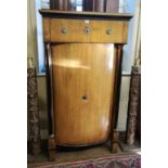 A FRENCH EMPIRE WALNUT SIDE CUPBOARD With one long drawer above a bow fronted cupboard enclosing