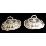 A PAIR OF EARLY 20TH CENTURY SILVER PLATED OCTAGONAL ENTRÉE DISHES Having a loop handle key and