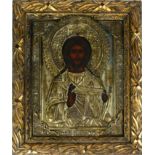 AN EARLY 19TH CENTURY RUSSIAN PROVINCIAL OIL ON CANVAS ICON ?CHRIST PANTOCRATOR? The borders