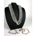 A COLLECTION OF VINTAGE WHITE METAL JEWELLERY Comprising a heavy gauge double necklace, a necklace