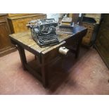 A 19TH CENTURY WAXED PINE WORK BENCH/TABLE With 5cm plank top wooden vice, on square legs. (125cm