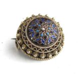A LATE 19TH/EARLY 20TH CENTURY NORWEGIAN SILVER AND CHAMPLEVÉ ENAMEL BROOCH Done form with fine