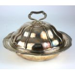 A VICTORIAN SILVER MUFFIN DISH AND COVER Having a carry handle with dome form lid and flutes,