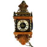 A 20TH CENTURY DUTCH OAK AND BRASS FIGURAL WALL CLOCK Having a figure of Atlas with globe finial and