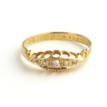 A VICTORIAN 18CT GOLD AND DIAMOND FIVE STONE RING The arrangement of graduating round cut stones