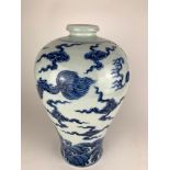 A CHINESE BLUE AND WHITE BALUSTER VASE Decorated with a four toed dragon amongst clouds. (36cm)