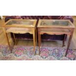 A PAIR OF EDWARDIAN MAHOGANY AND GLAZED BIJOUTERIE TABLES With hinged rectangular top, on square