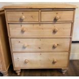 A VICTORIAN PINE CHEST Two short and three long drawers, raised on turned legs. (96cm x 46cm x