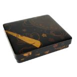 A JAPANESE LACQUERED AND DECORATED ARTIST/WRITING BOX The interior with copper ink kettle and bronze