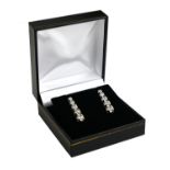 A PAIR OF 18CT WHITE GOLD DROP EARRINGS Set with 2ct of graduated diamonds. (length 2.7cm)