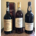 A BOTTLE OF GRAHAMS PORT, 1982 Boxed, along with 1975 Porto Kopke port and a bottle Château Saua