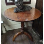 A 19TH CENTURY OAK SUPPER CIRCULAR TOP TABLE Raised on a turned column and three splayed legs. (