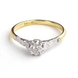 AN 18CT GOLD AND DIAMOND SOLITAIRE RING The single round cut diamond in a raised mount (size N).