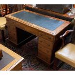 A VICTORIAN MAHOGANY TWIN PEDESTAL DESK With gilt tooled leather top above an arrangement of nine