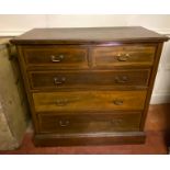 AN EDWARDIAN MAHOGANY AND LINE INLAID CHEST Of two short above three long drawers, raised on