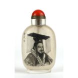 A CHINESE REVERSE PAINTED FROSTED GLASS AND HARDSTONE SNUFF BOTTLE Having a cabochon cut red stone