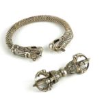 A CHINESE WHITE METAL DRAGON FORM BANGLE Opposing dragons clutching pearls, together with a white