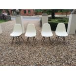 A SET OF FOUR VINTAGE EAMES DESIGN DINING CHAIRS.