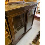 A LATE VICTORIAN OAK FLOOR STANDING BOOKCASE OF JACOBEAN DESIGN With two shaped bevelled glazed