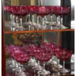 A SET OF TWELVE 19TH CENTURY CRANBERRY CHAMPAGNE SAUCERS Finely engraved with grapes and wines. (