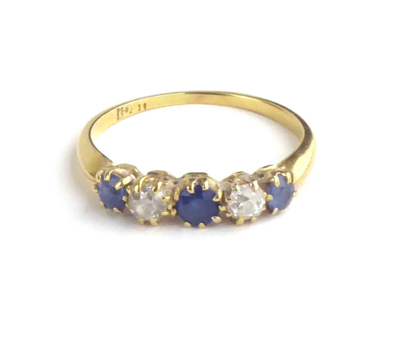 AN EARLY 18CT GOLD, DIAMOND AND SAPPHIRE FIVE STONE RING Three round cut sapphires interspersed with