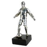 AN EARLY 20TH CENTURY SILVER PLATED STATUE OF A FOOTBALLER. (28.7cm)