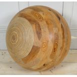 AN UNUSUAL LARGE PINE BALL CONSTRUCTED FROM CONCENTRIC SECTIONS. (diameter approx 58cm)