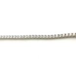 AN 18CT WHITE GOLD AND ROUND BRILLIANT CUT DIAMOND TENNIS BRACELET (diamond weight 5.11ct) (19.5cm)