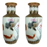A LARGE PAIR OF CHINESE PORCELAIN VASES Hand painted decoration of coy carp in a floral landscape,