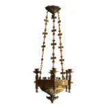 A GOTHIC BRASS SIX CANDLE CHANDLER With relief decoration, thistles. (90cm x 36cm)