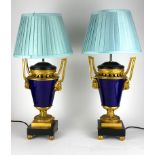 MANNER OF JEAN DULAC, PAIR OF 19TH CENTURY FRENCH BLUE PORCELAIN ORMOLU MOUNTED TWIN HANDLED LAMPS