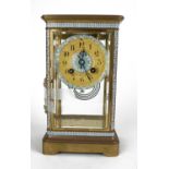 A FRENCH GILT BRASS AND CHAMPLEVÉ REGULATOR MANTEL CLOCK Four bevelled glass panels with blue and