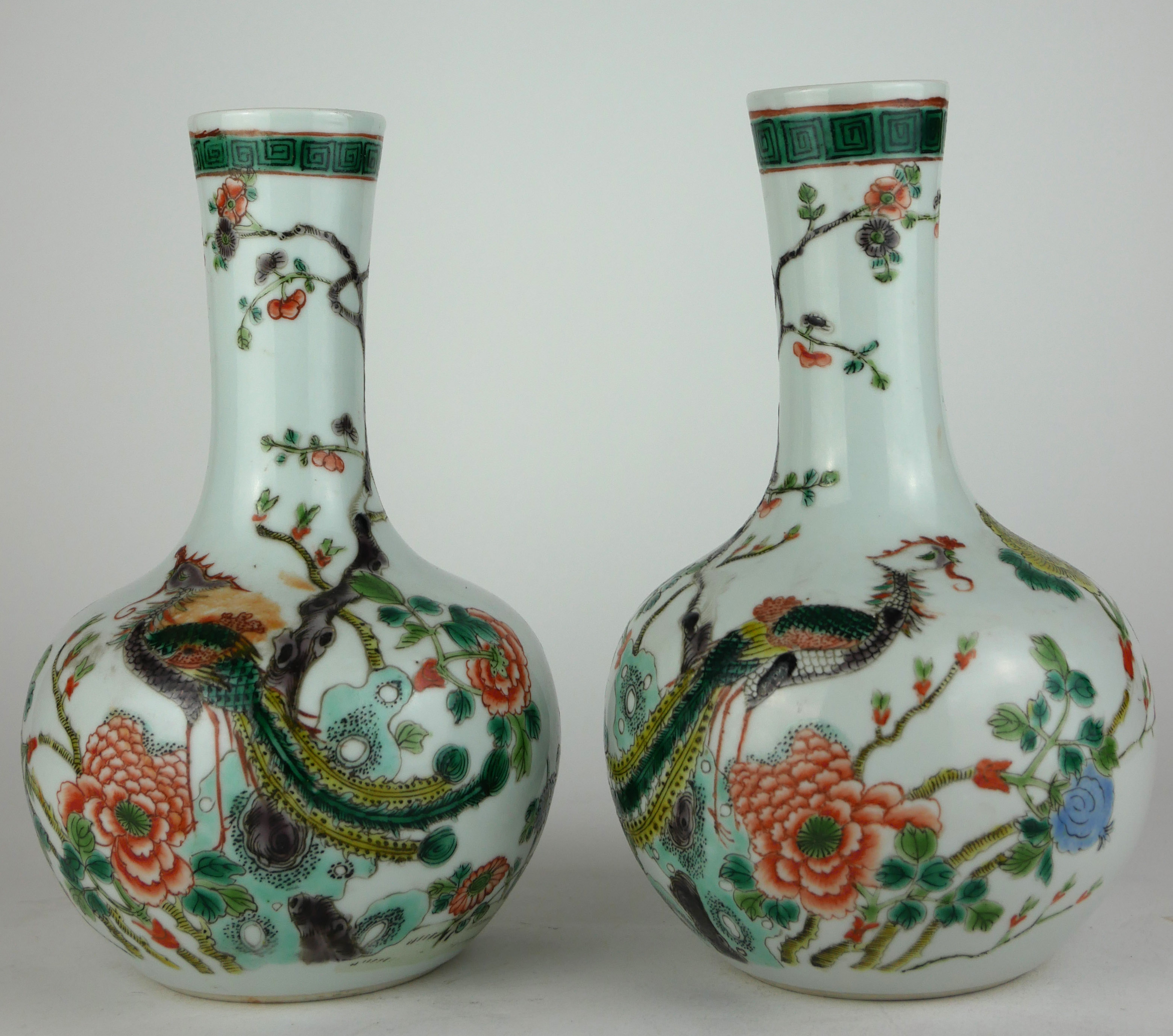 A PAIR OF 19TH CENTURY CHINESE VASES With enamelled decoration in the form of exotic birds amongst