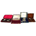 A COLLECTION OF CASED SILVER ITEMS To include an egg cup and spoon, fork and spoon, six teaspoons,