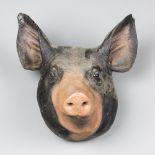 A 20TH CENTURY IMITATION PIGS HEAD (h 30cm x w 30cm x d 23cm)