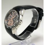 FESTINA, A DAY DATE STAINLESS STEEL WRISTWATCH Gilt numerals, on a black leather strap. Condition: