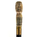 AN UNUSUAL BONE AND MAHOGANY PHRENOLOGY HEAD WALKING STICK Hand carved with Chinese Buddha head