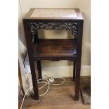 A 19TH CENTURY CHINESE HARDWOOD TWO TIER TABLE With rouge marble insert above a pierced fretwork