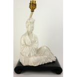 AN EARLY 20TH CENTURY CHINESE BLANC DE CHINE FIGURAL LAMP Seated female figure, on scrolled wooden