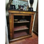 A VICTORIAN WALNUT PIER CABINET The single glazed door enclosing velvet lined shelves. (81cm x