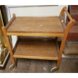 A MID CENTURY TEAK TEA TROLLEY. (70cm x 42cm x 76cm)