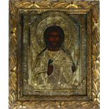 AN EARLY 19TH CENTURY RUSSIAN PROVINCIAL OIL ON CANVAS ICON 'CHRIST PANTOCRATOR' The borders