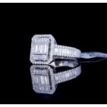 AN 18CT WHITE GOLD AND 1.3CT DIAMOND CLUSTER RING The arrangement of baguette cut diamonds edged