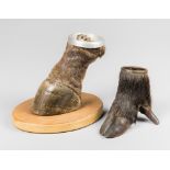 A 20TH CENTURY TAXIDERMY AFRICAN ANTELOPE FOOT ASHTRAY, TOGETHER WITH A BOAR FOOT ASHTRAY Largest (h