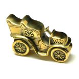 A BRASS 'MOTOR CAR' NOVELTY VESTA CASE Cast as an Edwardian motor car with hinged compartment and