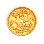 A QUEEN VICTORIA 22CT GOLD HALF SOVEREIGN COIN, DATED 1897 With George and Dragon to reverse.